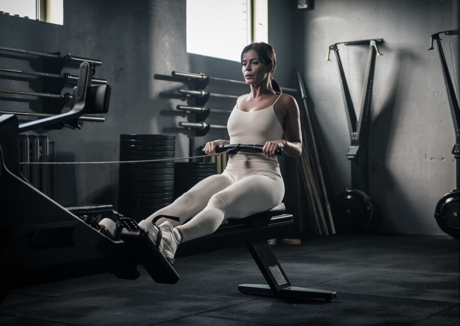 a woman using a rowing machine