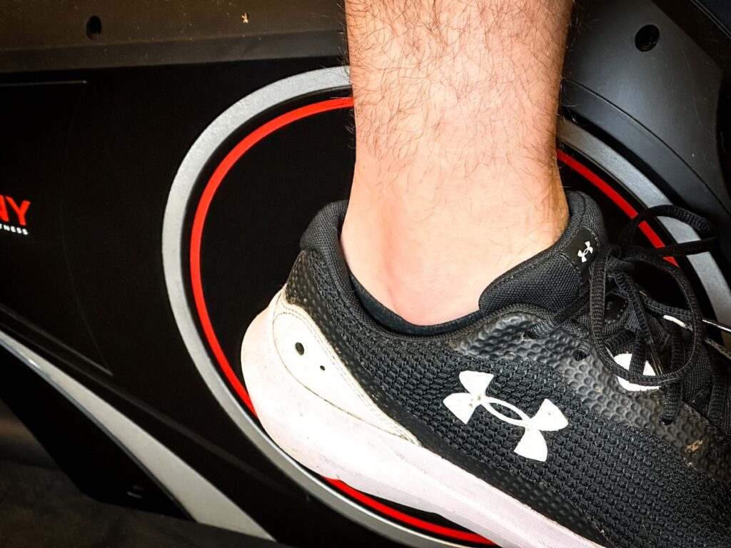 shoes clipped on a spin bike pedal